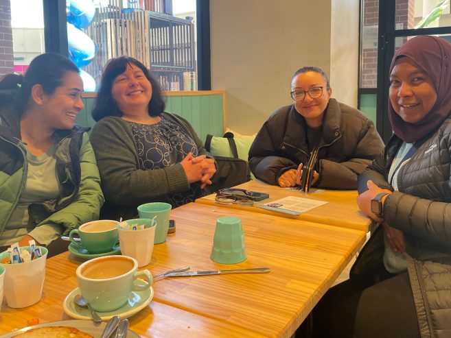 A group of people sitting at a table.