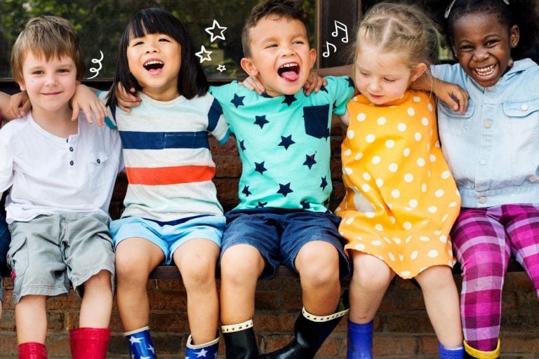 Five young children sit close together on a bench outdoors, smiling and laughing. They wear colorful outfits and rain boots, with doodles of stars and music notes drawn above their heads.