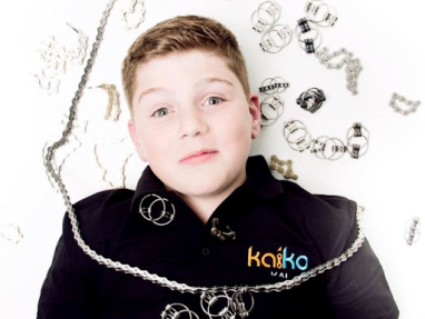 Kid laying with fidget toys