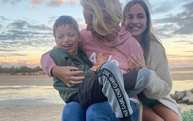 Bree holding her son Dax, beside her daughter Dylan