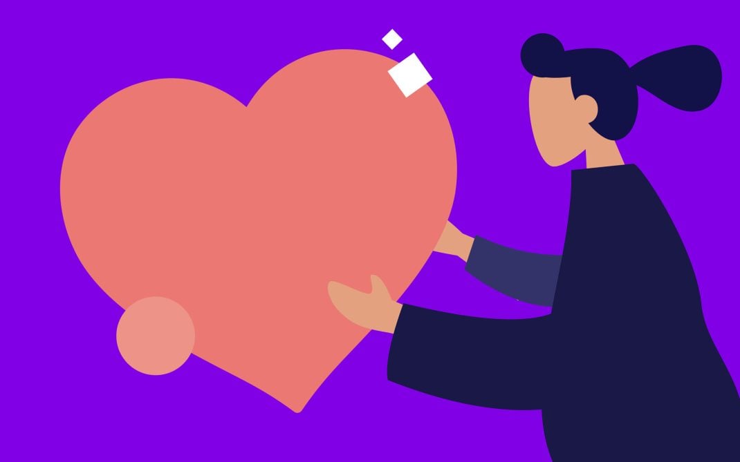 An illustration of a person with dark hair in a bun, wearing dark clothing, holding a large pink heart against a bright purple background. Simple geometric shapes and a minimalistic style are used.