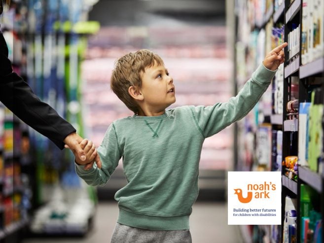 Child pointing at something at the shops