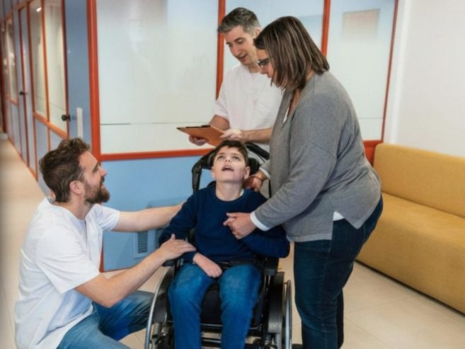 Family in Hospital with a child in a wheel chair
