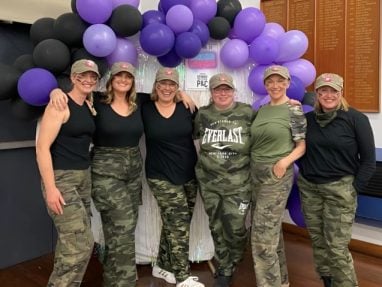 Group of mums standing together at a school fundraiser